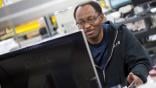 An AAR Corp. employee on the computer