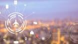 icons and an airplane icon over the background of a blurred city