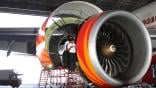 Technician works on an engine