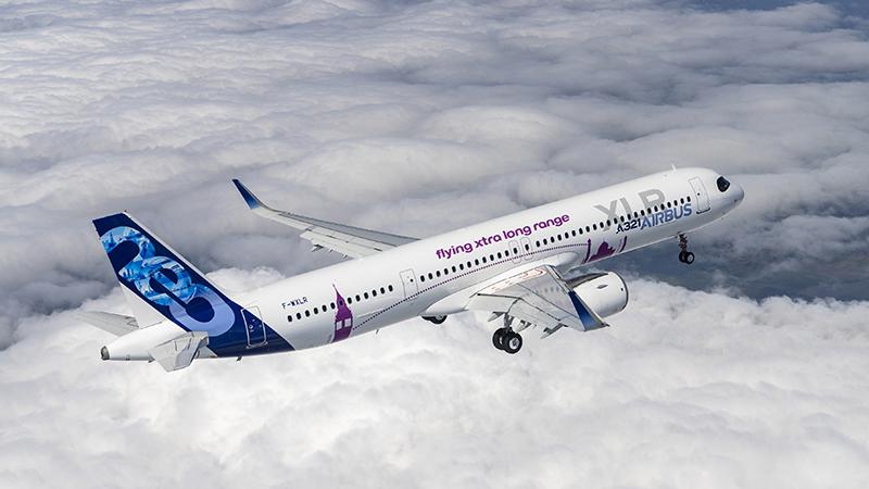 Airbus A321XLR flying above clouds