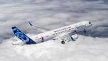 Airbus A321XLR flying above clouds