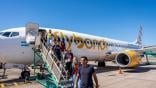 passengers disembark from a Flybondi aircraft 