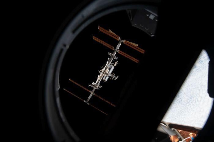 The International Space Station is pictured from inside a window aboard the SpaceX Crew Dragon Endeavour during a fly around of the orbiting lab that took place following its undocking from the Harmony module’s space-facing port on Nov. 8, 2021. NASA