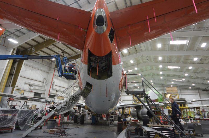 KF Aerospace aircraft inside hangar