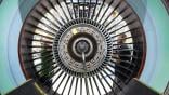 Two people seen through engine fan