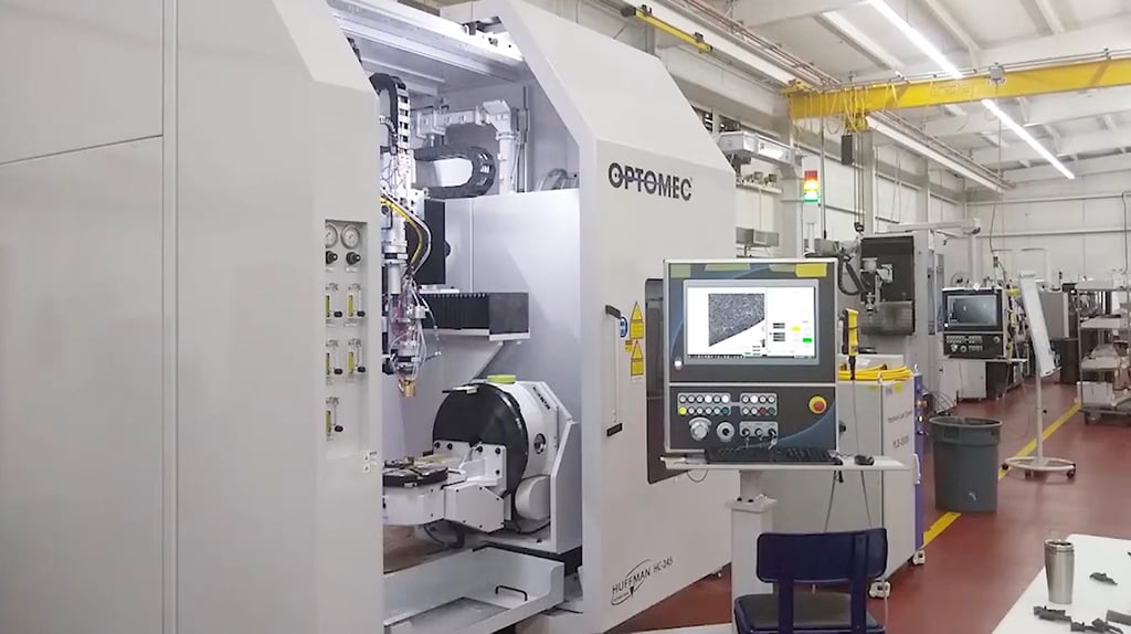 Optomec additive manufacturing