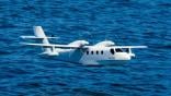 noemi all electric seaplane one-fifth subscale model in flight over water