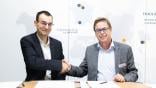 Francois Bastin, Safran Landing Systems CEO, and Oliver Legrand, Revima Group president and CEO, sign landing gear contract.