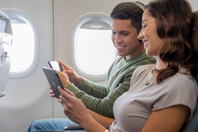 passengers looking at their iPads 