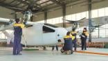 People standing around aircraft demonstrator