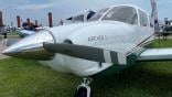 A UND-branded Piper Archer TX aircraft at EAA AirVenture in Oshkosh, Wisconsin. 